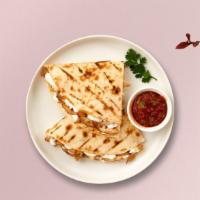 Cheese Quesadilla · Green peppers and onions wrapped with cheddar cheese in a grilled tortilla. Served with a si...