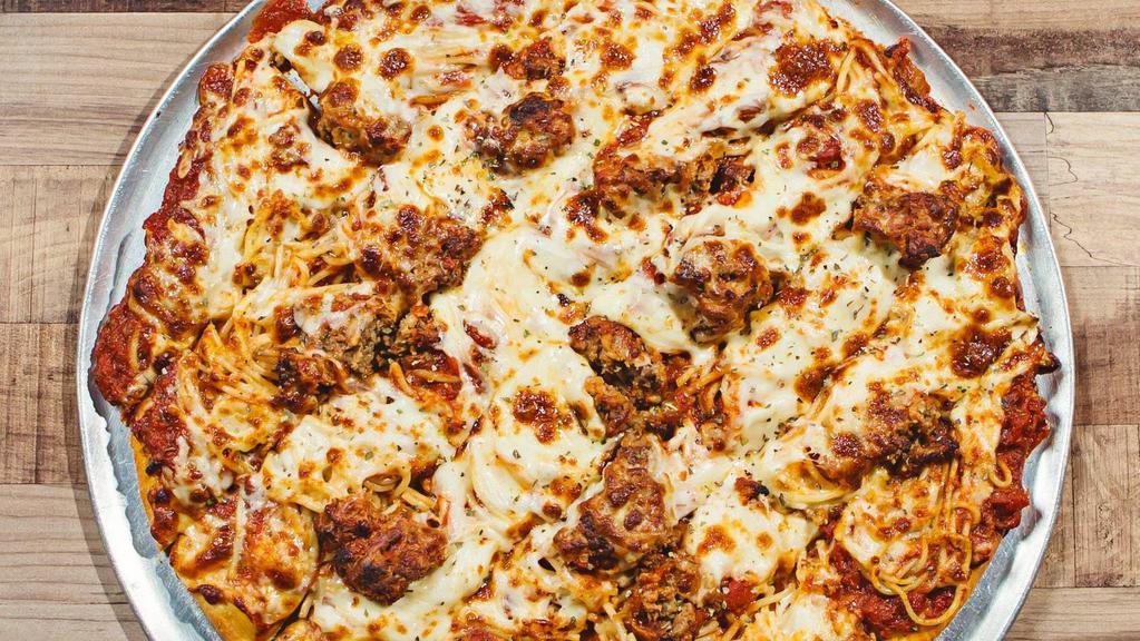Large Spaghetti & Meatball Pizza · A fine layer of Spaghetti noodles and our homemade Meatballs on top of marinara and a light layer of garlic butter covered in Mozzarella