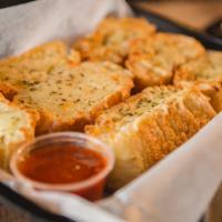 Garlic Bread W/Cheese · Garlic toast covered in Mozzarella dashed with oregano and it comes with a cup of marinara s...
