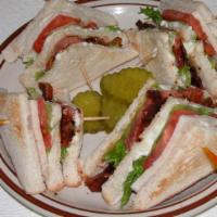 Triple Decker Club · Oven-roasted turkey breast, bacon, lettuce, tomato, and mayonnaise on toast.