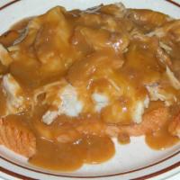 Roast Turkey Breast · With gravy stacked on mashed potatoes and grilled Texas toast.
