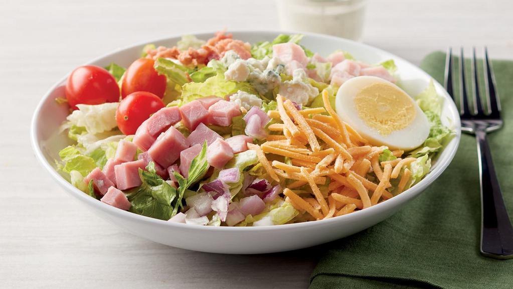 Dilusso Cobb Salad · Romaine Lettuce with tomatoes, eggs, diced ham, diced turkey, cheddar cheese, Blue cheese, bacon pieces, and red onion. (70 cal./220 cal.)