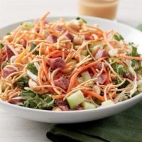 Dilusso Asian Noodle Salad · Kale and green cabbage topped with diced beef, cucumbers, carrots, crispy rice noodles, and ...