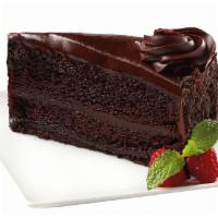 Fudge Cake · Moist fudge cake layered with rich chocolate fudge icing, finished with chocolate cream rose...