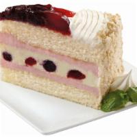 All American Cheesecake · Vanilla cake, strawberry mascarpone mousse and cheesecake swirled with blueberries and straw...