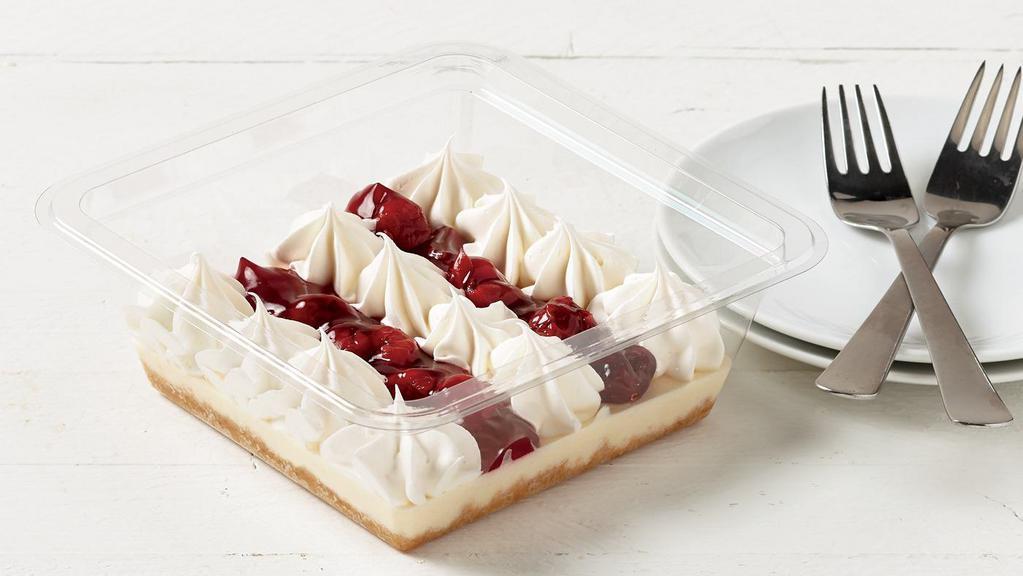 Cherry Cheesecake · Cream cheese flavored cheesecake filling over a graham cracker base. Topped with cherry pie filling and whipped topping. 210 cal. per 1/2 cup/640 cal. per container