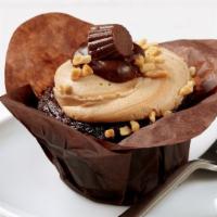 Peanut Butter Cup Cupcake  · Rich, decadent, milk chocolate cake topped with creamy peanut butter icing. Garnished with a...