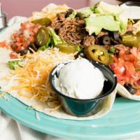 Southwest Taco Salad · Traditional filling with jalapenos, black olives, and a side of sour cream.