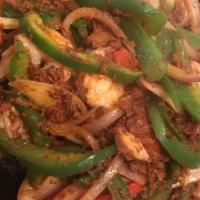Hawaiian Fajita · Chorizo sautéed with fajita chicken, Shrimp, red onions, and red and green peppers. Served w...