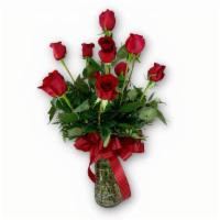 Long Stem Red Rose Arrangement · Dz long stem red roses arranged in a clear glass vase. Product containers of equal or greate...