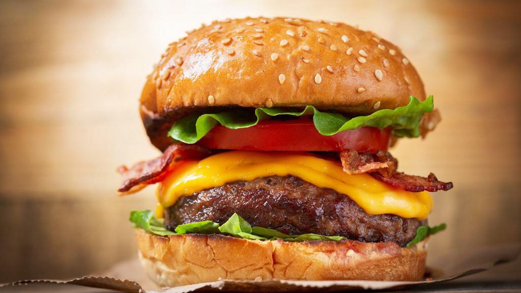 Cheddar Bacon Burger · Classic fresh grilled Prime Beef patty, sizzling bacon, Merkts cheddar and ketchup on a fresh brioche bun.