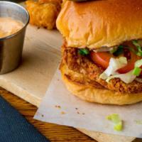 Hot Honey Chicken Sandwich · Deep fried crispy chicken tenders topped with lettuce, pickles,
our secret ranch sauce and h...