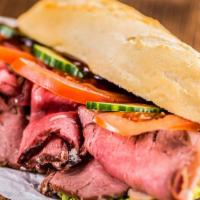 Italian Beef Sandwich · Thinly sliced Italian roast beef with your choice of sweet or hot pepper on a toasted hoagie...
