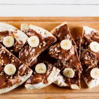 Nutella Pizza · Just like pizza but better, with generous dollops of Nutella and you can eat the whole thing...