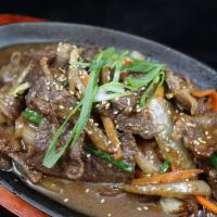 Ribeye Bulgogi · Tender, marinated ribeye beef with veggies and a side of rice.