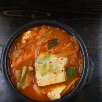 Kimchi Stew/ 김치찌개 · Famous Korean traditional stew. Kimchi, pork, tofu and veggies in a spicy broth. Served with...