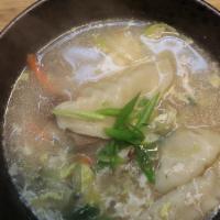 Dumpling Soup / 떡 만두국 · Soft rice cakes, veggies, egg and dumplings in a light broth with your choice of protein (me...