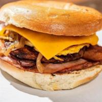 Breakfast Cruiser · Plain bagel, honey ham, breakfast sausage, slab bacon, caramelized onions and Cheddar cheese.