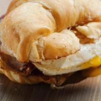 Build Your Own Breakfast Sandwich · Start with a hand-cracked egg and choose your bread, protein, and cheese.