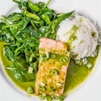 Moroccan Spiced Salmon · Served with sauteed garlic spinach, cilantro almond chutney, side salad and rice