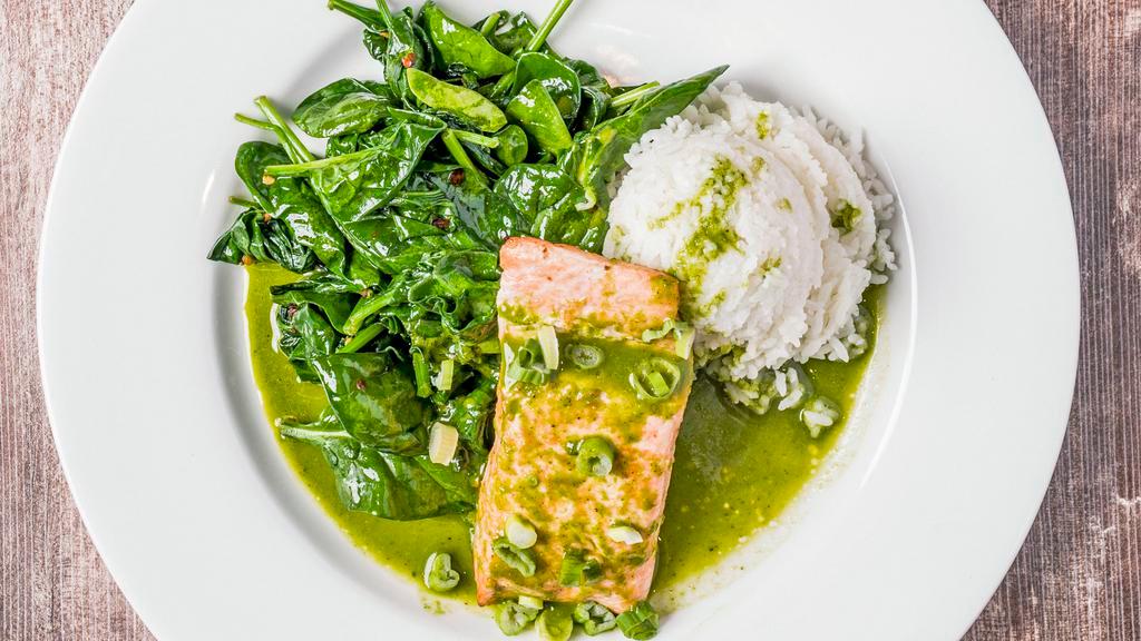 Moroccan Spiced Salmon · Served with sauteed garlic spinach, cilantro almond chutney, side salad and rice