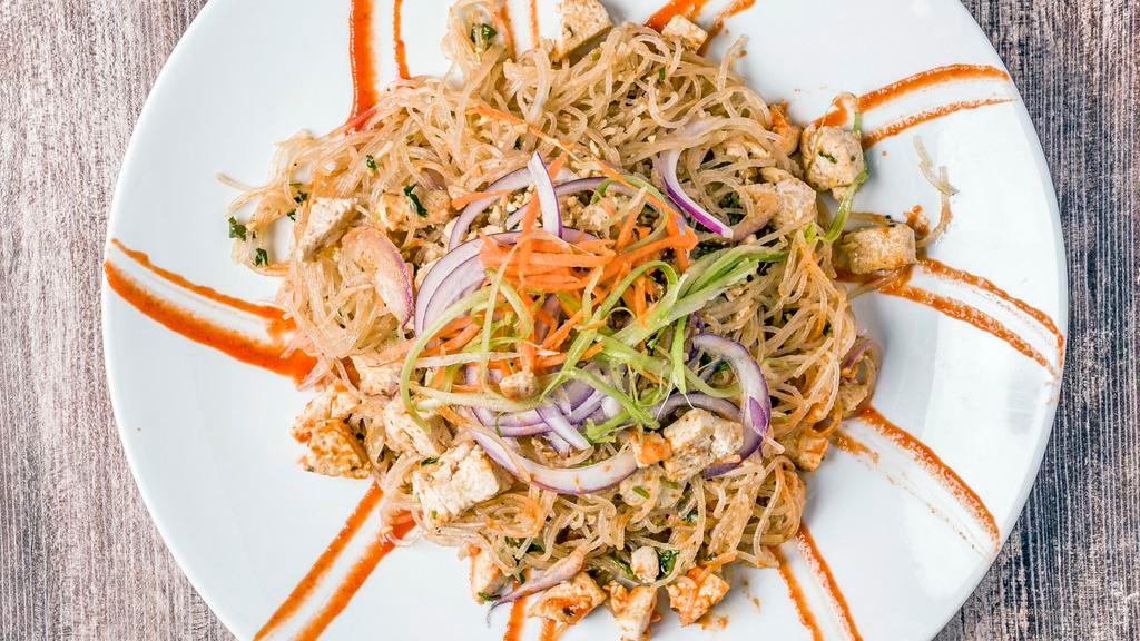 Coconut Lemongrass Noodles · Thai style noodles with tofu, red onions , peanuts & sriracha in coconut and peanut  butter sauce.  Vegan.