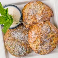Tea Scone Trio · Three freshly backed scones with a side of creamy and sweet scone spread