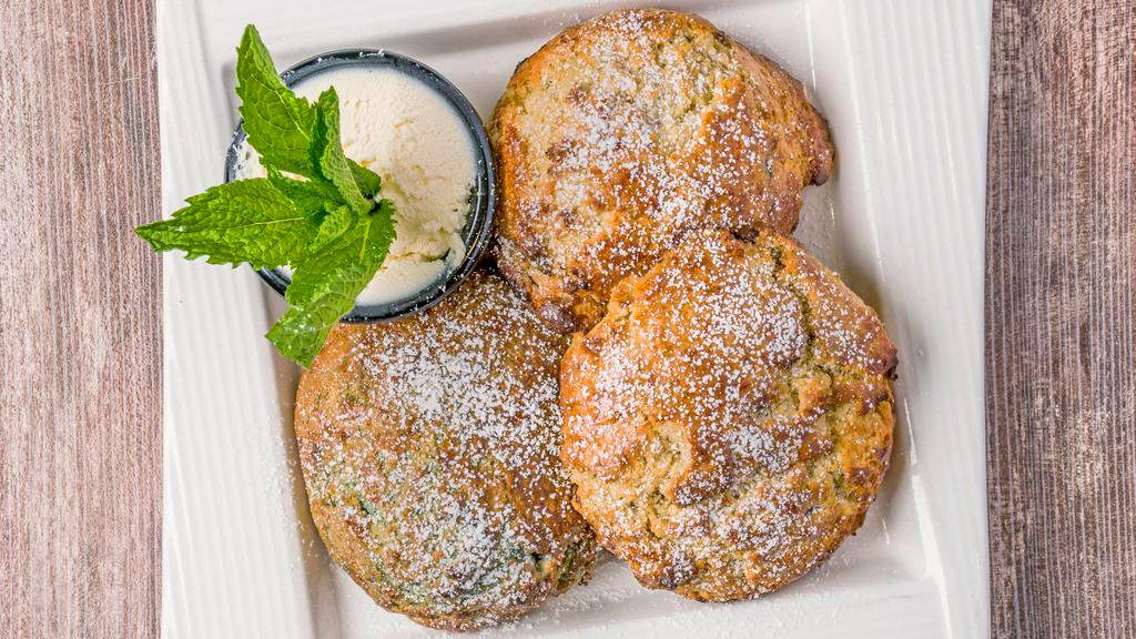 Tea Scone Trio · Three freshly backed scones with a side of creamy and sweet scone spread