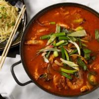 Spicy Seafood Hot Pot Noodles  · Spicy. W/ pork, seafood, and vegetables in red chili broth.