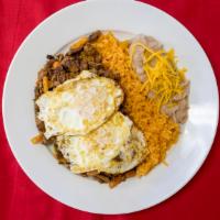 Steak Ranchero · Grilled steak with pico de gallo and spicy salsa  rice and beans.
