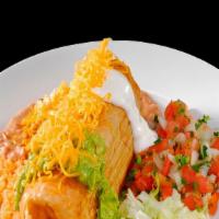 Chimichanga · Chimichanga with sour cream,guacamole and cheese on top and lettuce,pico de gallo rice and b...