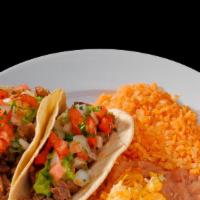 Two Carne Asada Tacos · two steak tacos with   guacamole and pico de gallo  
rice and beans