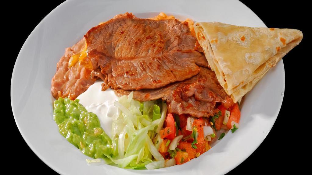Carne Asada · Grilled steak pico de gallo,lettuce,sour cream,guacamole,rice and beans