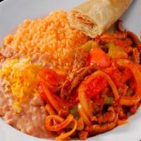 Steak Fajita · Grilled steak with onion,tomatoes,pepper,spicy sauce,rice and beans
