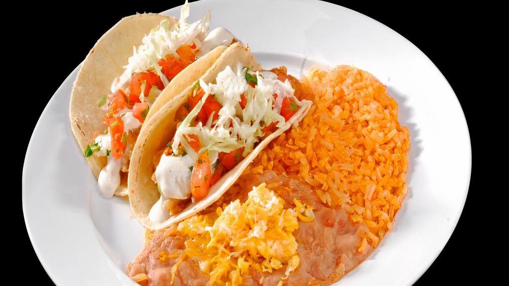 Two Fish Tacos · two fish tacos with pico de gallo,cabagge and tartar sauce  rice and beans