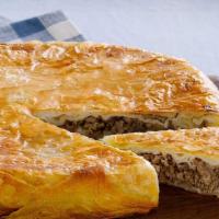 Meat Pie · Round 12 inch pie filled with Ground Beef and Caramelized Onions