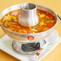Tom Yum Soup* (Shrimp Or Seafood) · Hot and sour soup with mushrooms in a broth made of Thai spices, chili paste, tomatoes, lime...