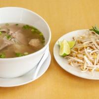 Thai Pho 66 · Thin rice noodles in a savory broth, served with sliced beef, meatballs, onions, bean sprout...