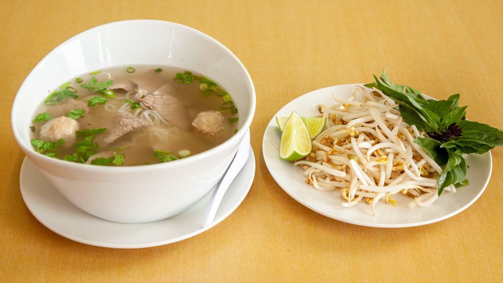 Thai Pho 66 · Thin rice noodles in a savory broth, served with sliced beef, meatballs, onions, bean sprouts, and cilantro.