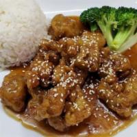 Sesame Chicken · Crispy chunks of chicken stir-fried with a thick sweet sauce and sesame seeds.