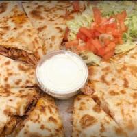 Ashley Quesadilla · Comes in a pizza box with Flower tortilla and lettuce, tomatoes on the side.