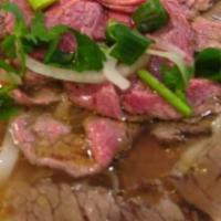 Filet Mignon Pho · Savory beef broth noodle soup served with thinly sliced rare filet mignon
cilantro, scallion...