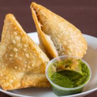 Chicken Samosa · A savory Indian pastry filled with our secret seasoned potatoes with peas and cilantro. Enjo...