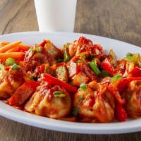 C-Momo · MoMo sauteed with red onions and bell peppers in a sweet and spicy sauce