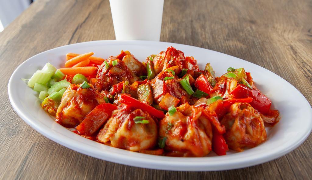 C-Momo · MoMo sauteed with red onions and bell peppers in a sweet and spicy sauce