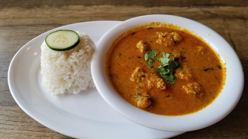 Butter Chicken Curry · Boneless Chicken slowly simmered in creamy tomato sauce. Served with rice.