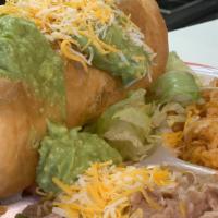 Chimichanga Plate · Includes rice and beans.