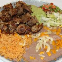 Carnitas Plate · With rice and beans.