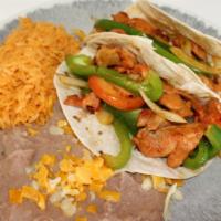 2 Fajita Steak Tacos · FAJITAS, CHEESE AND LETTUCE.