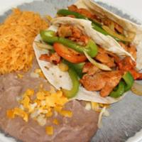 2 Fajita Chicken Tacos · FAJITAS, CHEESE AND LETTUCE.